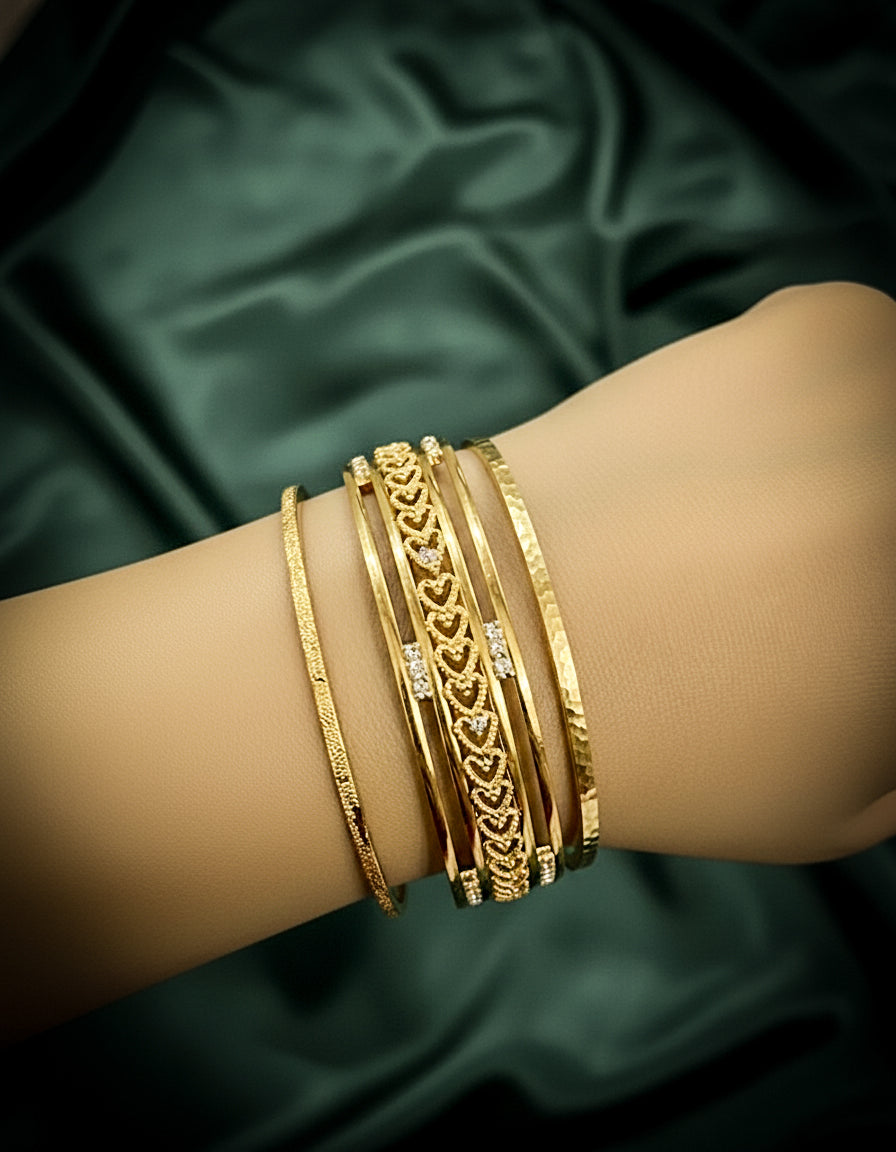 Gold plated bangles with a wave and filigree